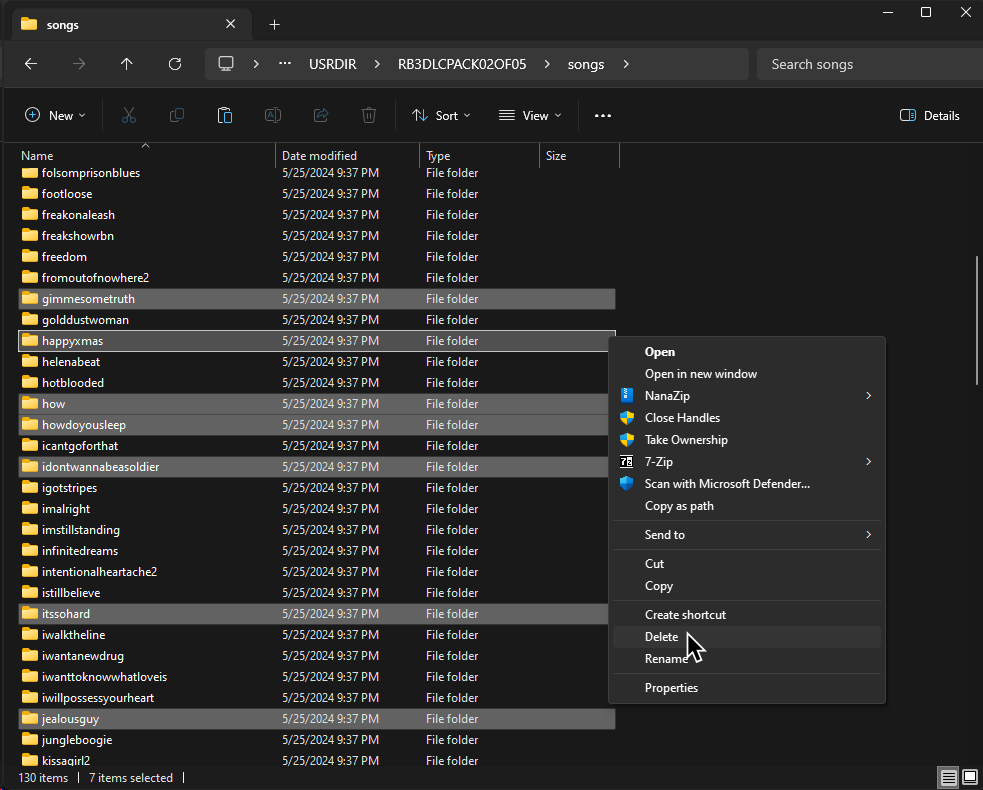 A screenshot of a file browser window. Multiple songs are selected and the cursor hovers over a popup menu option that says "Delete."